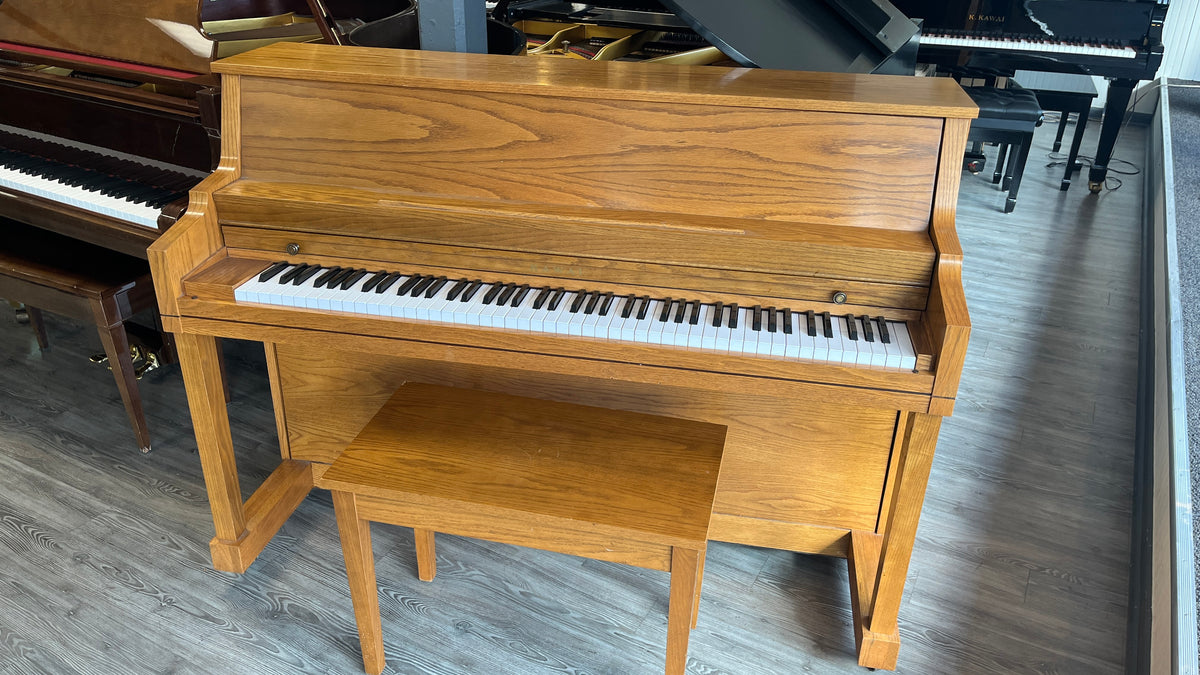 Kawai 42" Console Piano Model 502-S (Satin Oak Finish) with studio toe-leg design